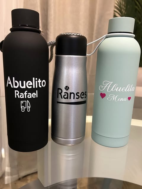 Three water bottles personalized with names